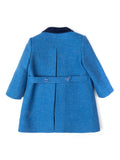 Vista trasera abrigo inglés azul para niña y niño